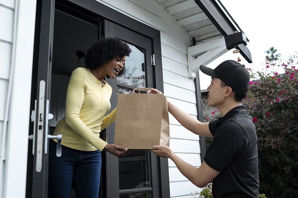 delivery-person-getting-parcel-out-delivery