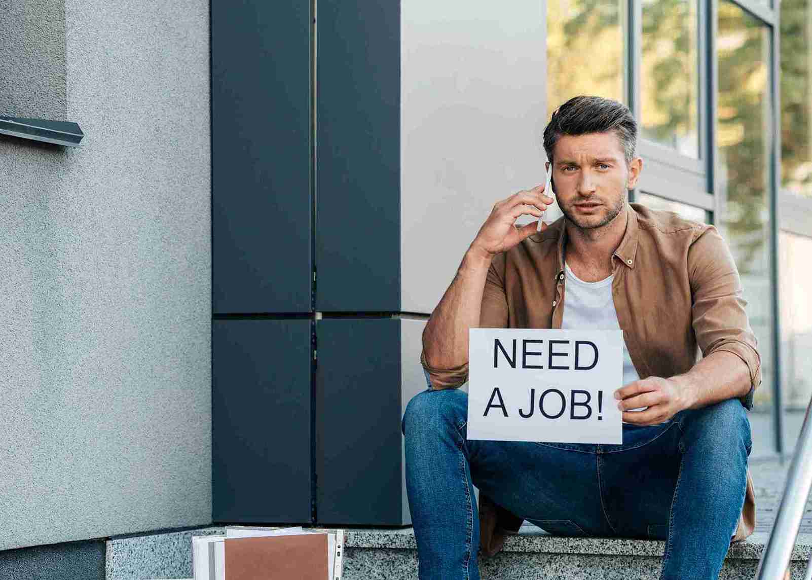 medium-shot-unemployed-talking-phone