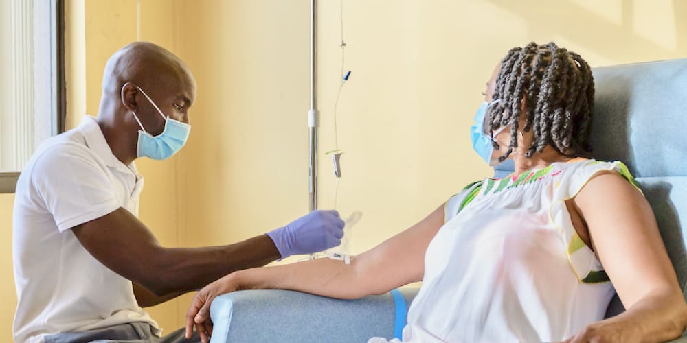 Greg-Bowen-administers-IV-to-client. (1)