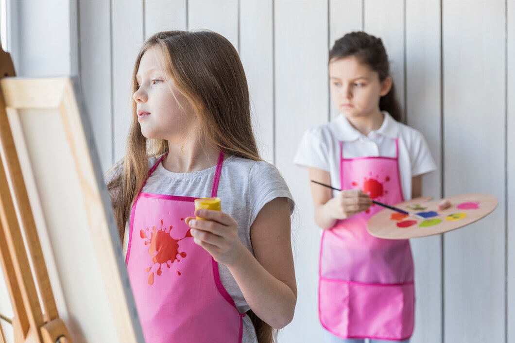 blonde-girl-painting-easel-her-friend-standing-background_23-2148088516 (1)