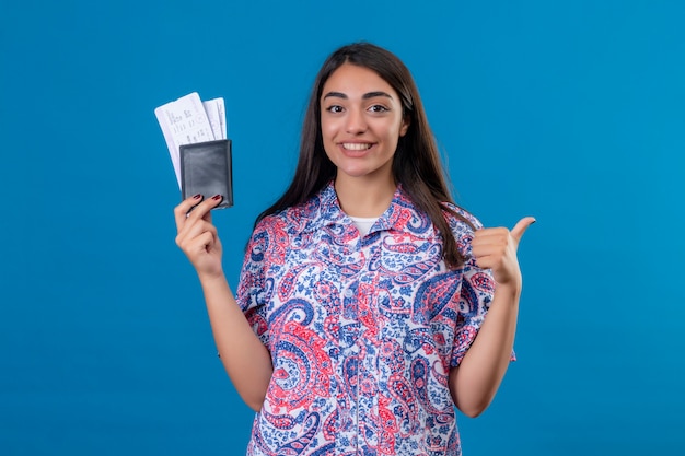 young-beautiful-woman-tourist-holding-passport-with-tickets-smil(1)