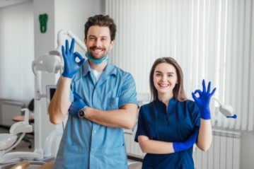 photo-smiling-dentist-standing-with-arms-crossed-with-her-colleague-showing-okay-sign (1) (1) (1) (1) (1) (1) (1) (1)
