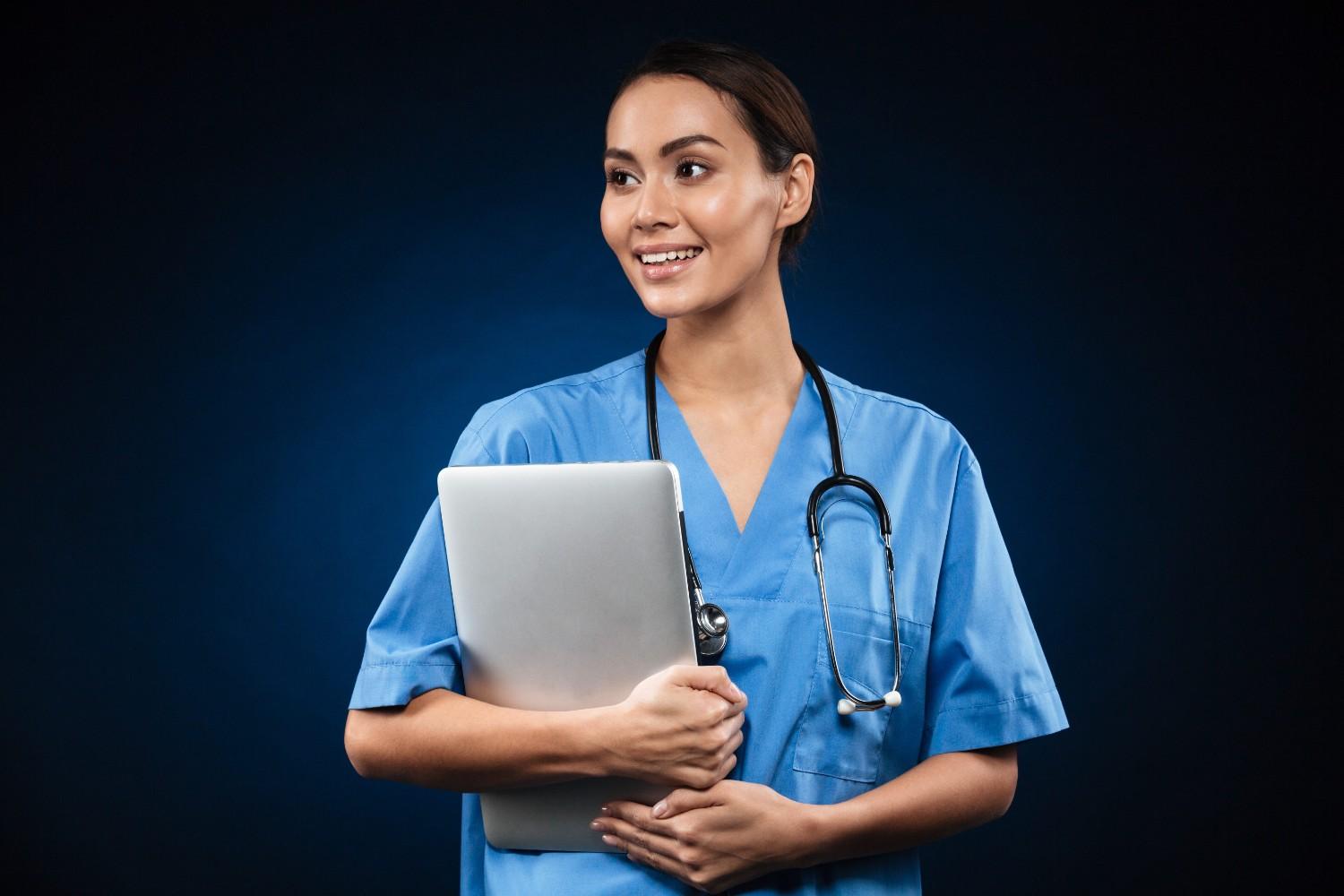 u7987-pretty-lady-doctor-with-laptop-computer-looking-aside-2